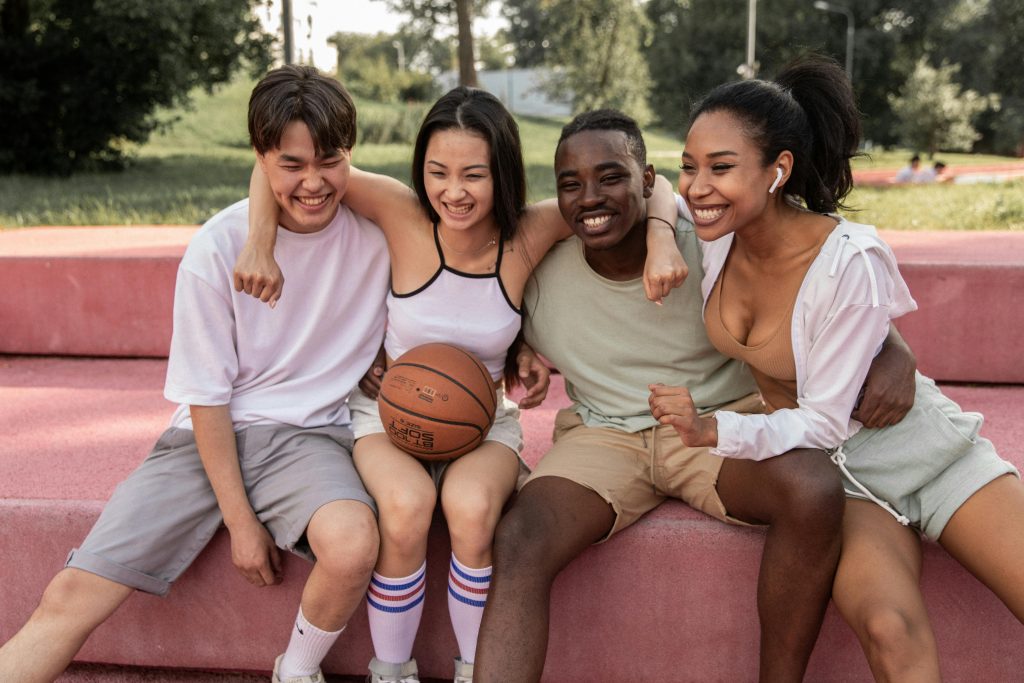 Teenagers hanging out hugging